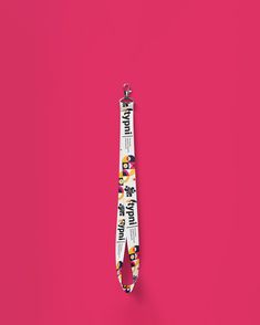 a lanyard on a pink background