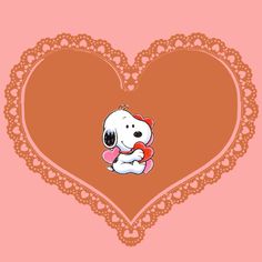 a heart shaped doily with a cartoon dog holding a teddy bear in it's lap