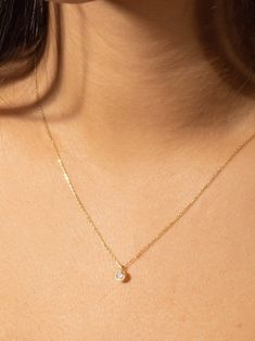 "This solitaire diamond necklace is made of 14k Solid Yellow Gold and round cut solitaire zircon stone. A dainty minimalist gold jewelry and cool piece combining perfect with daily outfits and a perfect gift for her :)  We can produce it in 14k Solid Yellow Gold, 14k White Gold or in 14k Solid Rose Gold, please choose from options list.  The \"Single Diamond Necklace\" has a round cut zircon pendant. We can produce it with real diamond as special order. Please contact with us via Etsy Message fo Gold Solitaire Necklace In Sterling Silver, Everyday Solitaire Necklace With Delicate Cubic Zirconia Chain, Minimalist Solitaire Necklace With Delicate Chain, Dainty Diamond Necklace With Bezel Setting, Everyday Minimalist Solitaire Necklace With Bezel Setting, Dainty Solitaire Diamond Necklace With Round Pendant, Dainty Solitaire Necklace With Round Cut For Everyday, Delicate Solitaire Necklace With Cubic Zirconia, Dainty Everyday Solitaire Necklace With Round Cut