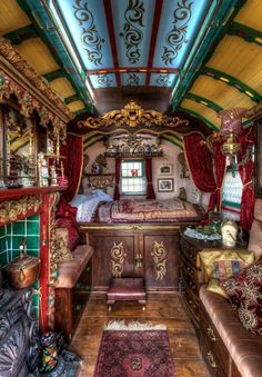 the interior of an old bus with furniture and decorations