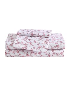 three sheets with pink flowers on them and one sheet is folded over the other side