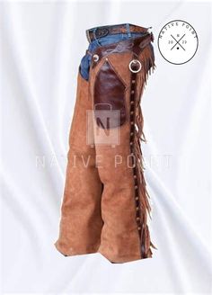 Men Native Western Cowboy Style Leather Chap Fringes Suede Leather Pant Suede Leather Chap Riding Leather Chaps Welcome to Native Point ! *         100 % Genuine top quality suede leather. *          Many Colours *         Closure: Buckle, Fringes *         Lining Material : Leather *          Fringe work *         Handmade stitched work Return Policy: We take pride & joy in our products and above all customer satisfaction is very important to us. Due to this we aim to respond to any customer qu Cowboy Chaps Pattern, Denim Chaps, Pink Chaps, Women’s Western Chaps, Western Chaps, Cowboy Pants, Riding Chaps, Leather Pant, Cowboy Style