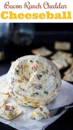 bacon ranch cheddar cheeseball on a napkin with crackers