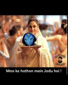 a woman in sari holding a plate with an avatar on it and the caption reads, maa ke hathon mein jadu hai