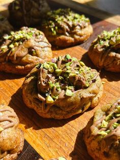 chocolate chip cookies with nuts and pistachios on a cutting board, ready to be eaten