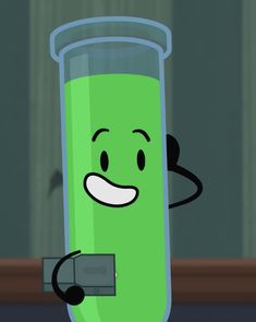 a green tube with a smiley face holding a cell phone