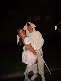 two people in bunny costumes posing for the camera