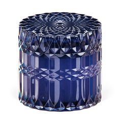 a blue glass jar with geometric designs on it