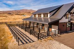 a house with a metal roof in the middle of nowhere