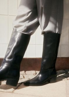 KELSEY Tall Black Leather Boots by Swedish brand Vagabond Shoemakers. Black leather tall boots with a Western-inspired look. These boots are crafted in black leather with a pointed toe shape, pull-on shaft with decorative seams. Sleek block heel measures just under 2 inches. Black knee-high western boots. The perfect pair of minimalistic black leather tall boots to wear dressy or casually. Wear these pull-on tall black boots with jumpsuits, mini skirts, wide leg jeans, a pleated midi skirt or lo Black Leather Tall Boots, Tall Black Leather Boots, Knee High Western Boots, Vagabond Shoemakers, Decorative Seams, Tall Black Boots, Leather Tall Boots, Swedish Brands, Black Boots Tall