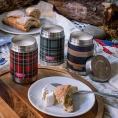 a plate with some food on it next to two canisters