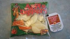 an apple dipper bag next to a package of apples and a packet of ice cream