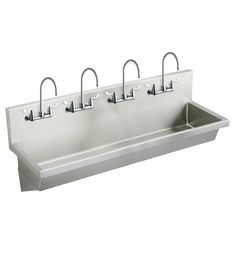 a double sink with three faucets on each side