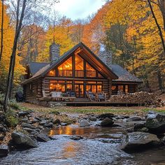 Cozy autumn cabin surrounded by vibrant forest foliage and a babbling stream, ideal for nature retreats. Autumn Cabin, Manifesting My Dream Life, Photos To Paint, Cabin Retreat, Tommy Lee, Cabins And Cottages, Cabin Life, Cozy Autumn