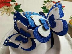 a white plate topped with blue and white flowers