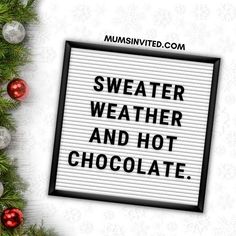 a sign that says, sweater weather and hot chocolate on the side of a christmas tree