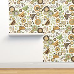 the wall paper is designed to look like an abstract floral pattern with leaves and flowers on it