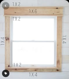 the measurements for a window frame are shown in front of a white wall with wood planks