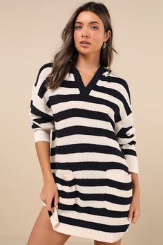 The Lulus Cuddled Up Days Ivory and Navy Striped Hooded Mini Sweater Dress is the best way to stay as cozy as you are stylish this season! Soft and chunky sweater knit (with an ivory and navy striped pattern) shapes this winter-ready dress that features a hooded, relaxed bodice with a notched neckline and long sleeves with drop shoulders. The wide-cut silhouette boasts twin, functional patch pockets at the front before ending at a cute mini hem. Ribbed knit accents the neckline, pockets, cuffs, Mini Sweater Dress Lulus, Fitted Sweater Dress For Day Out, Mini Length, Trendy Stretch Sweater Dress, Mini Length, Cozy Fitted V-neck Sweater Dress, Casual V-neck Ribbed Sweater Dress, Mini Sweater Dress, Chunky Sweater, Navy Stripes, Stripes Pattern