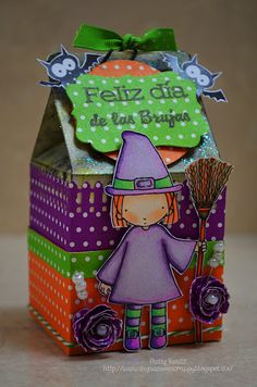 a halloween treat box with a little witch on it