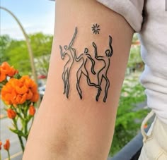 a woman with a tattoo on her arm that has an image of two deers