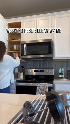 a woman standing in a kitchen next to a stove top oven with the words weekend rest clean w / me on it