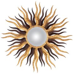 a sun shaped mirror is shown against a white background with gold and brown accents on it