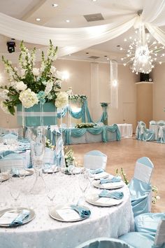 a banquet hall with blue and white decor