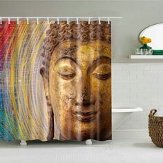 a shower curtain with a buddha head on it