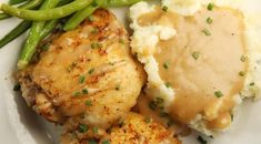 chicken, mashed potatoes and green beans on a plate