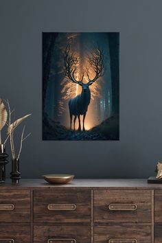 a deer standing in the middle of a forest at night