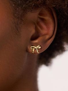 Trending and sweet, these bow earrings plated in 14k gold feature a bow silhouette and tarnish-proof finish designed to effortlessly tie your look together. Bow Silhouette, Bow Earrings, Letter Necklace, Online Jewelry Store, Gold Design, Designer Earrings, Perfect Outfit, Online Jewelry, Jewelry Stores