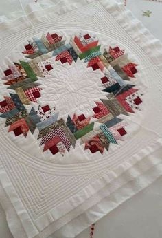 a close up of a quilt on a table