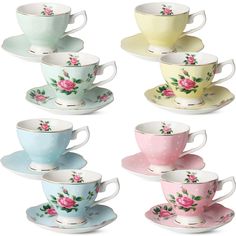 six different colored cups and saucers with pink flowers on the rims, all stacked together