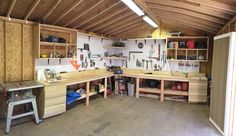 a garage filled with lots of workbenches and tools