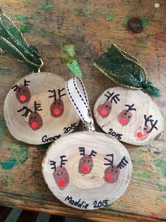 three wooden slices with christmas decorations on them