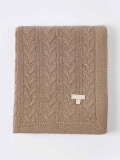 the cable knit blanket in camel