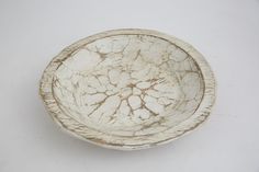 a white bowl sitting on top of a table