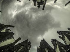 looking up into the sky at some buildings