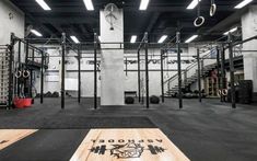 the inside of a crossfit gym with various equipment