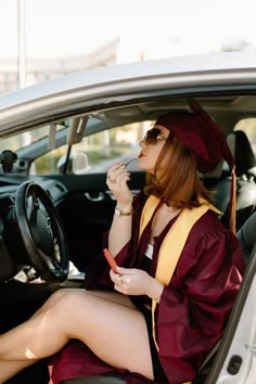 a woman sitting in the driver's seat of a car