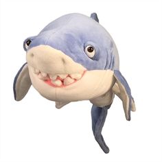 a stuffed shark with its mouth open and smiling