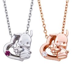 two necklaces that are shaped like animals and one has a small dog on it