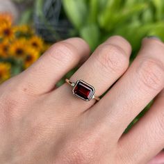 14KT yellow gold bezel-set octagonal/ emerald-cut Mozambique red garnet + accent diamond ring. Stunning, deep red color! Garnet is the birthstone for January babies- and this piece makes a birthstone ring/ engagement ring! Since this is a custom piece, each garnet will vary slightly from stock photo. Can also be made with a different gemstone instead of garnet- please reach out for pricing, as it varies on each gemstone. Size 7 Can be resized for an additional fee Weight: 4.00 grams Band width: Lozenge Cut, Diamond Accent Ring, Deep Red Color, Custom Ring, Custom Ring Designs, Red Garnet, Ring Engagement, Birthstone Ring, Ring Size 7