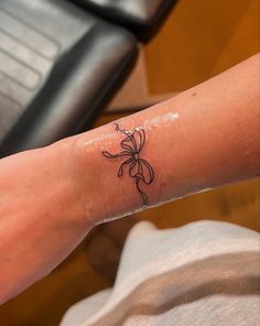 Bow Above Knee Tattoo, Bow Bracelet Tattoo, Bow On Wrist Tattoo, Croquette Aesthetic Tattoo, Bow Wrist Tattoo, Thigh Bow Tattoo, Croquette Tattoo, Lower Back Tattoos For Women Classy, Hello Kitty Bow Tattoo