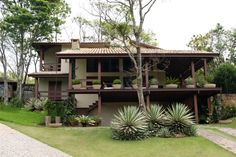 the house is surrounded by trees and plants