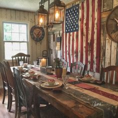 an american flag is hanging over the dining room table