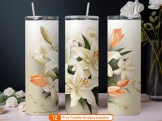 three vases with flowers painted on them sitting next to each other and one has a straw in it