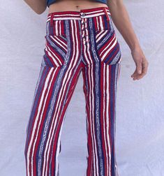 EPIC 60s/70s Hippie Bellbottom Pants, perfect for July 4th! Feels like denim-weight cotton. Have been hand altered at back of waist. See measurements below- MEASUREMENTS: Waist: 13.5" across (medium rise- I'm a size 25 true waist and these fit me perfect) Rise: 9.5"  Inseam: 27" Pant leg opening: 10.5" across Label: Montgomerey Ward All sales final, please ask any questions and check measurements before purchasing. Retro High Waist Cotton Jeans, Retro Mid-rise Cotton Flare Jeans, 70s Inspired Fitted Flare Cotton Jeans, Retro High-waisted Jeans For Summer, Retro High-waisted Summer Jeans, Fitted 70s Inspired Cotton Flare Jeans, Wide Leg Bottoms With Retro Print For Summer, Retro Mid-rise Summer Pants, Retro High Waist Cotton Flare Jeans