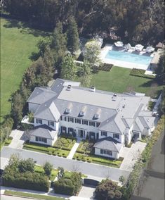 an aerial view of a large white house